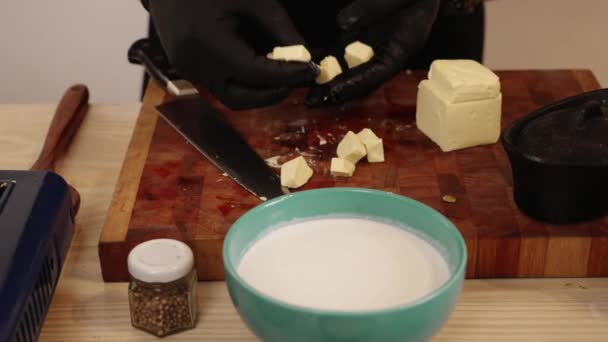Professional Chef Hands Gloves Pick Small Cubes Butter Chopping Board — Video Stock