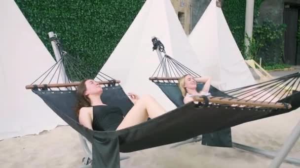 Two Sexy Beautiful Attractive Young Caucasian Woman Lie Hammock Spa — Stockvideo