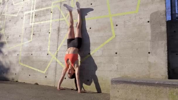 Woman Getting Handstand Position Wall Coming — Stockvideo
