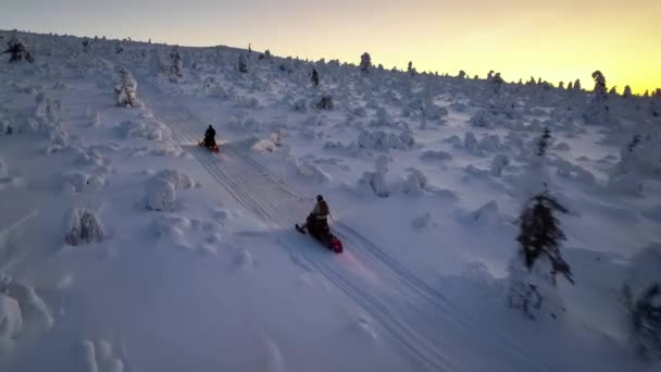 Aerial Drone View Tracking Snow Sleds Climbing Steep Fell Winter — Vídeo de Stock