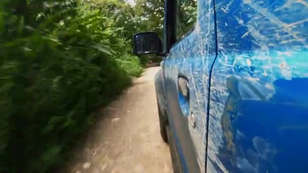 Pov Shot Side Road Vehicle Driving Puddle Deep Jungle — Stockvideo