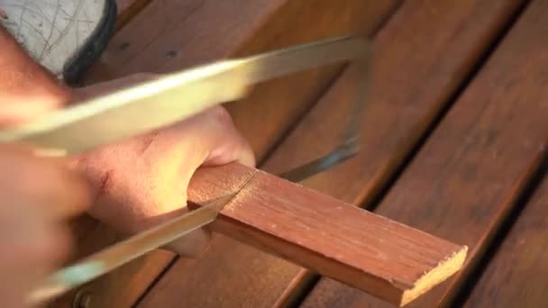 Skilled Carpenter Working Hand Saw Cutting Wood Daytime Close — стоковое видео