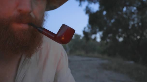 Close Shot Ginger Bearded Bushman Farm Smoking Tobacco Pipe — Stockvideo