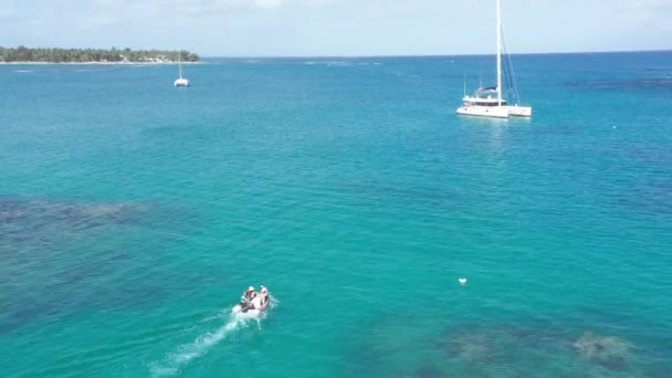 Small Motorboat Cruising Luxury Catamaran Sunlight Caribbean Sea Dominican Republic — Vídeo de Stock