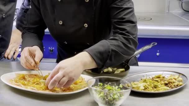 Woman Dishing High Cuisine Dish While Teacher Supervising — стоковое видео