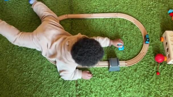 Two Year Old Afroeuropean Child Playing His Toy Train Home — Vídeos de Stock