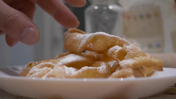 Person Pick Homemade Faworki Sprinkled Powdered Sugar Plate Close — Stock Video