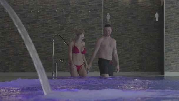Romantic Couple Steps Indoor Swimming Pool Wellness Spa Rendezvous Slow — стокове відео