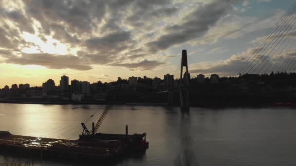 Sky Bridge Suspension Train Track Spanning River Silhouette Barge Crane — Stock Video