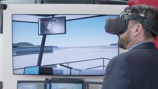 Man Wearing Virtual Reality Headpiece Testing Air Traffic Ground Control — Stockvideo