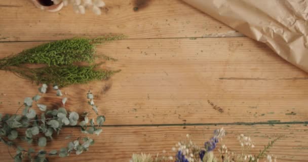 Person Holding Beautiful Arrangement Preserved Dried Flowers Wooden Table High — Stok video