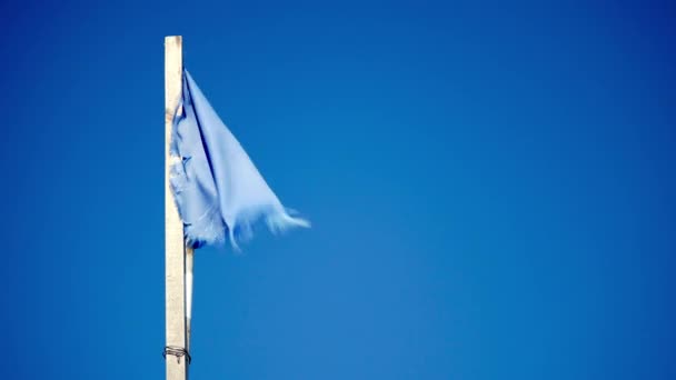 Old Torn Blue Cloth Flag Wind Waving Blue Sky Background — Stock Video