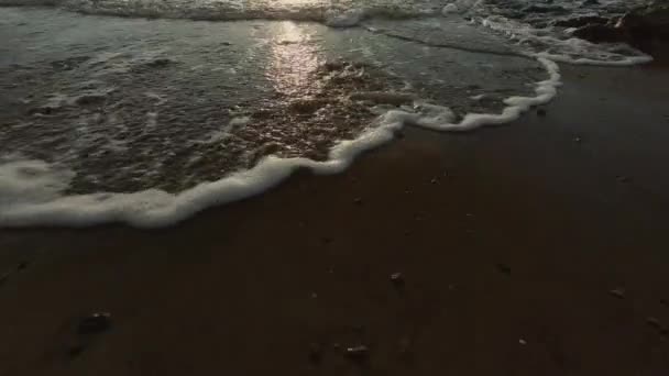 Slow Motion Wave Crashing Flowing Beach Sunset Ireland Low Angle — ストック動画