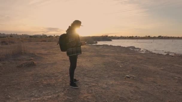 Man Holding Remote Controller Screen Flying Drone Sunset Handheld — Stockvideo