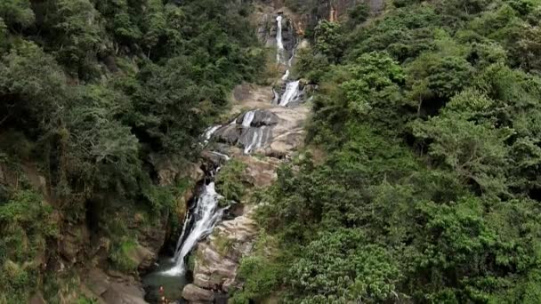 Aerial Lowering Ravana Falls Streaming Natural Pool Surrounded Dense Green — Video