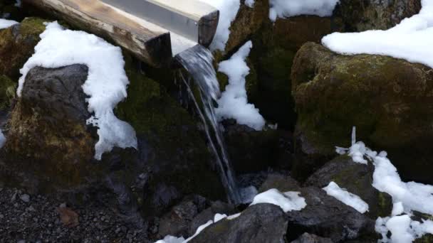 Slowly Flowing Water Wooden Beam Falls Large Dark Stones Which — Vídeo de stock