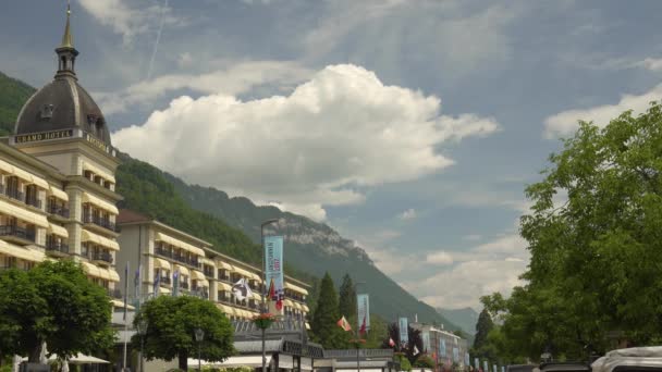 Luxurious Victoria Jungfrau Hotel Alps Mountains Covered Vegetation Background Cloudy — Stock Video