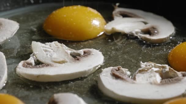 Macro Shot Sliced Champignon Mushrooms Eggs Pan Sprinkled Salt Cayenne — Vídeos de Stock