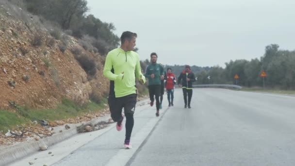 Group Afghan Men Running Road Greece Tracking Shot — Video Stock