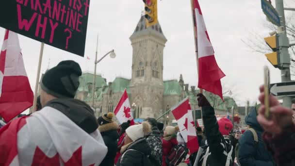 People Demonstrating Covid Vaccine Rules Holding Flags Freedom Convoy 2022 — Stockvideo