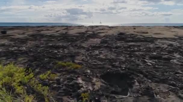 Drone Flying Low Volcanic Rocky Shore Pacific Ocean Sunlight Reflection — Stock videók