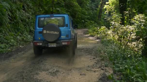 Jeep Driving Puddle Dirt Roads Tropical Jungle Slow Motion View — Stockvideo
