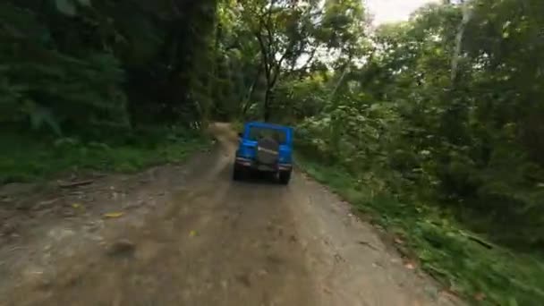 Fpv Drone Shot Jeep Driving Dirt Roads Tropical Jungle Pov — Stockvideo