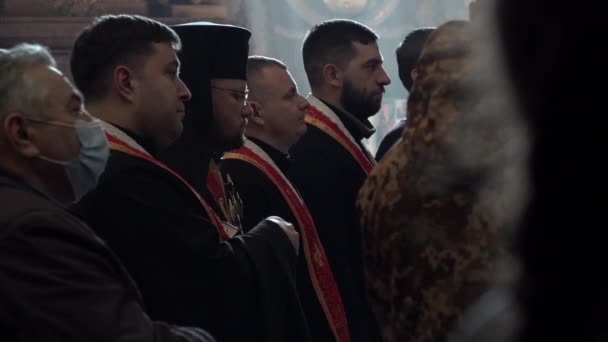 Four Priests Stand Line Front Light Pouring Church Window Funeral — Stockvideo