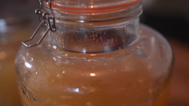 Downward Shot Pitcher Juice Jar Containing Ginger Liqueur Called Ingwerer — Stock Video