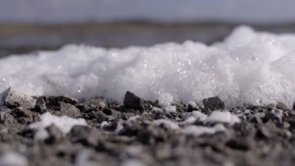 Close Low Angled Shot White Ocean Foam Fluttering Strong Sea — Stock Video