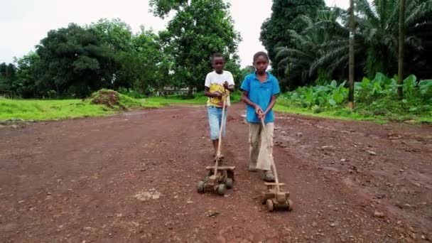 Aerial View African Children Playing Toys Low Reverse Drone Shot — Vídeo de Stock