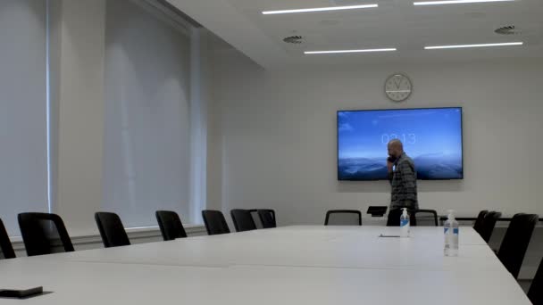 Male Asian Office Employee Pacing Empty Boardroom Seeking Privacy While — Wideo stockowe