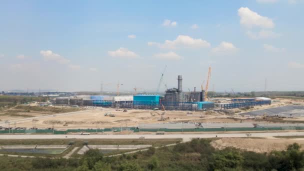 Massive Construction Site Cranes Rising Horizon Aerial Tracking View — Vídeos de Stock