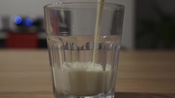 Close Shot Milk Being Poured Glass Kitchen Counter — Stockvideo