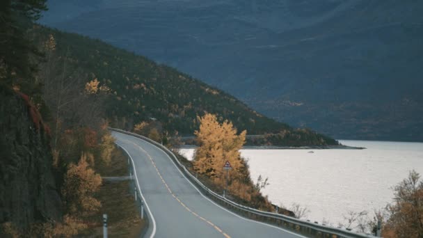 Narrow Two Lane Road Snaking Fjord Snow Capped Mountains Horizon — Video Stock