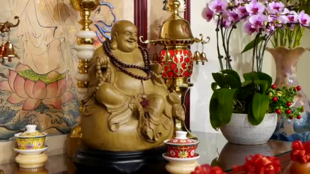 Wooden Statue Laughing Buddha Sitting Shrine Filmed Panning Motion — Wideo stockowe