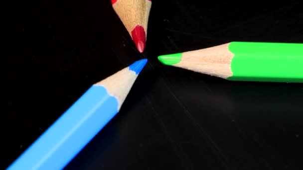 Red Green Blue Crayons Pointing Each Other Slowly Rotating Macro — Wideo stockowe