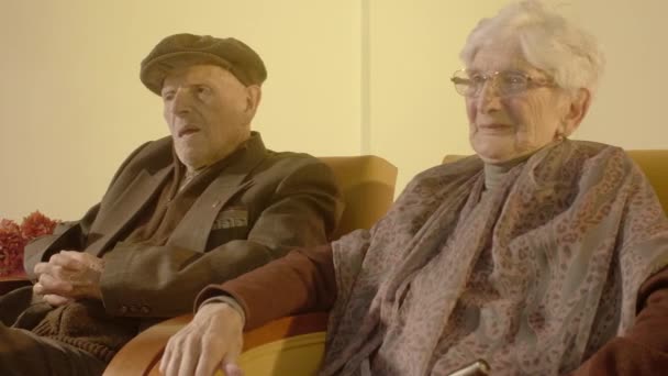 Elder Couple Sitting Couches — Stockvideo