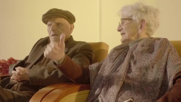 Elder Couple Sitting Couches — Stockvideo