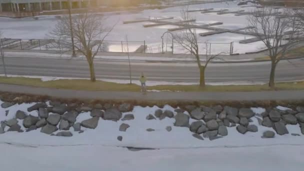 Young Women Enjoying Late Winter Evening Snow Aerial Looking Camera — Stock Video