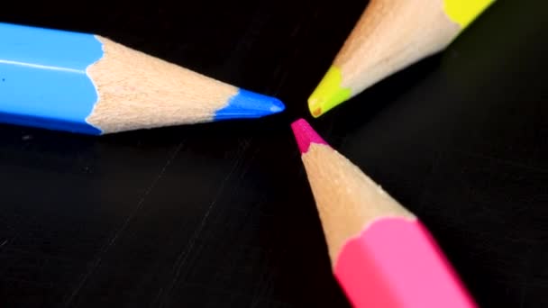 Cyan Magenta Yellow Crayons Forming Triangle Grayscale Concept Macro Shot — Wideo stockowe