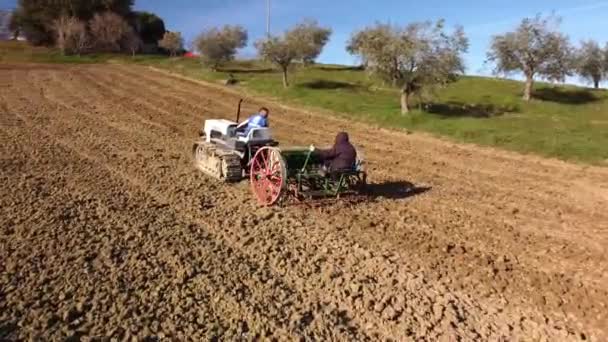 People Crawler Tractor Seeder Sowing Field Sunset Aerial Approaching Shot — Stock Video