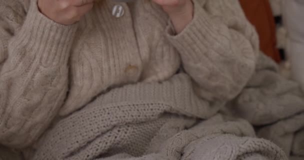 Woman Wool Coat Sitting Sofa Drinking Tea Gimbal Close — Stock Video