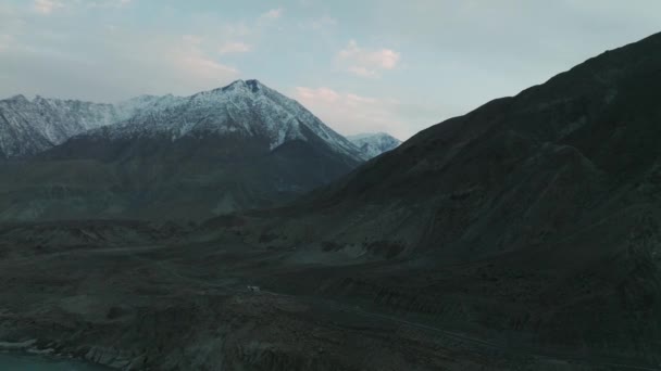 Aerial Dolly Left Moody Overcast Hunza Valley Snow Capped Mountains — Wideo stockowe