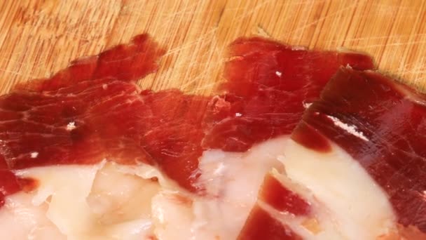 Fatty Prosciutto Slices Rotating Wooden Board Macro Shot Close View — Stockvideo
