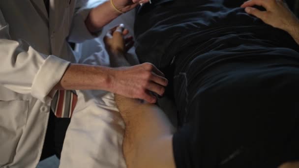 Holistic Doctor Adjusting Acupuncture Needles Male Patient Arm Slow Motion — Stockvideo