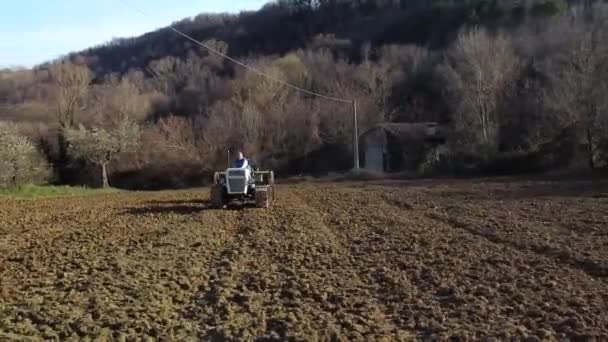 White Crawler Tractor Seeder Moving Field Aerial Ground Level Shot — Stock Video