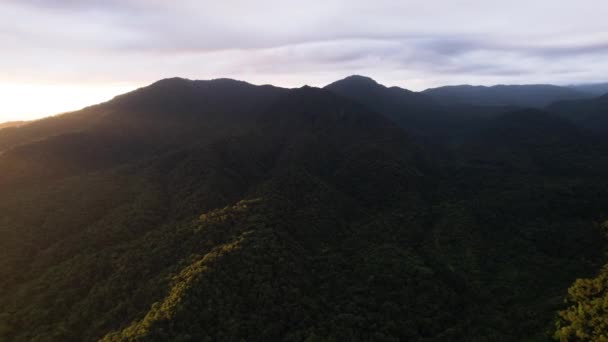Yellow Sun Rays Crossing Forested Mountains Costa Rican Jungle Aerial — Vídeos de Stock