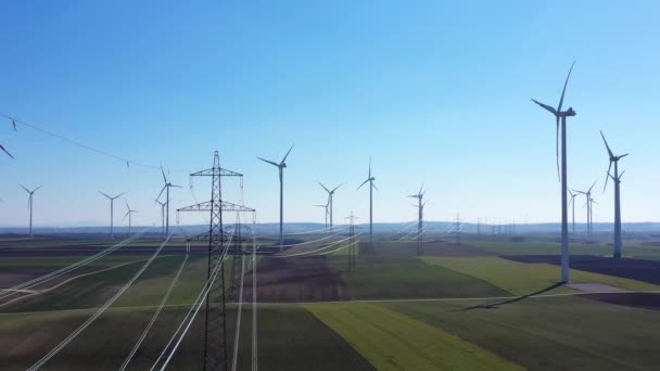 Windmills Power Lines Green Fields Blue Sky Background Aerial Drone — Video