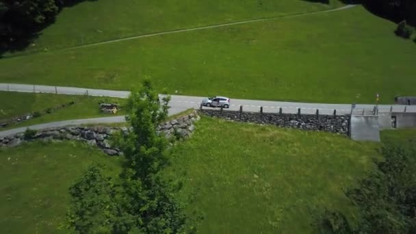 Aerial Rising Man Car Parked Side Road Green Valley Surrounded — Video